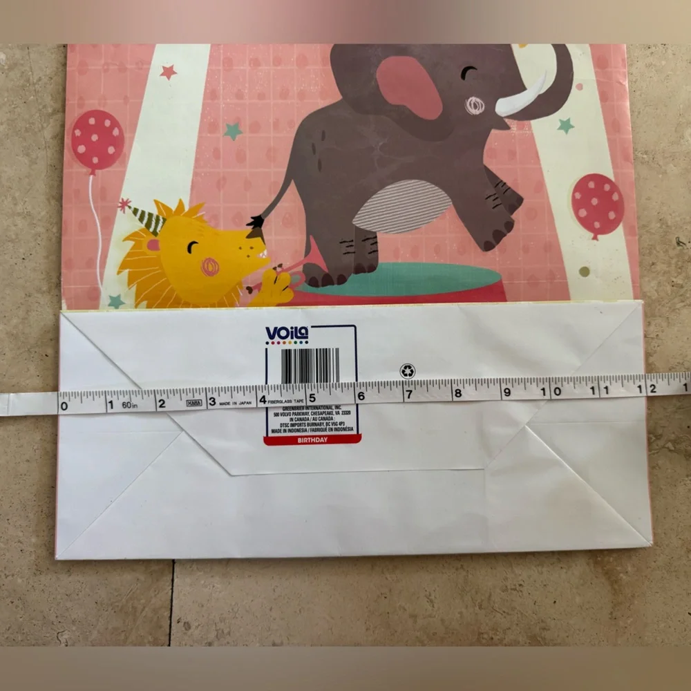pink baby shower gift bag with circus scene